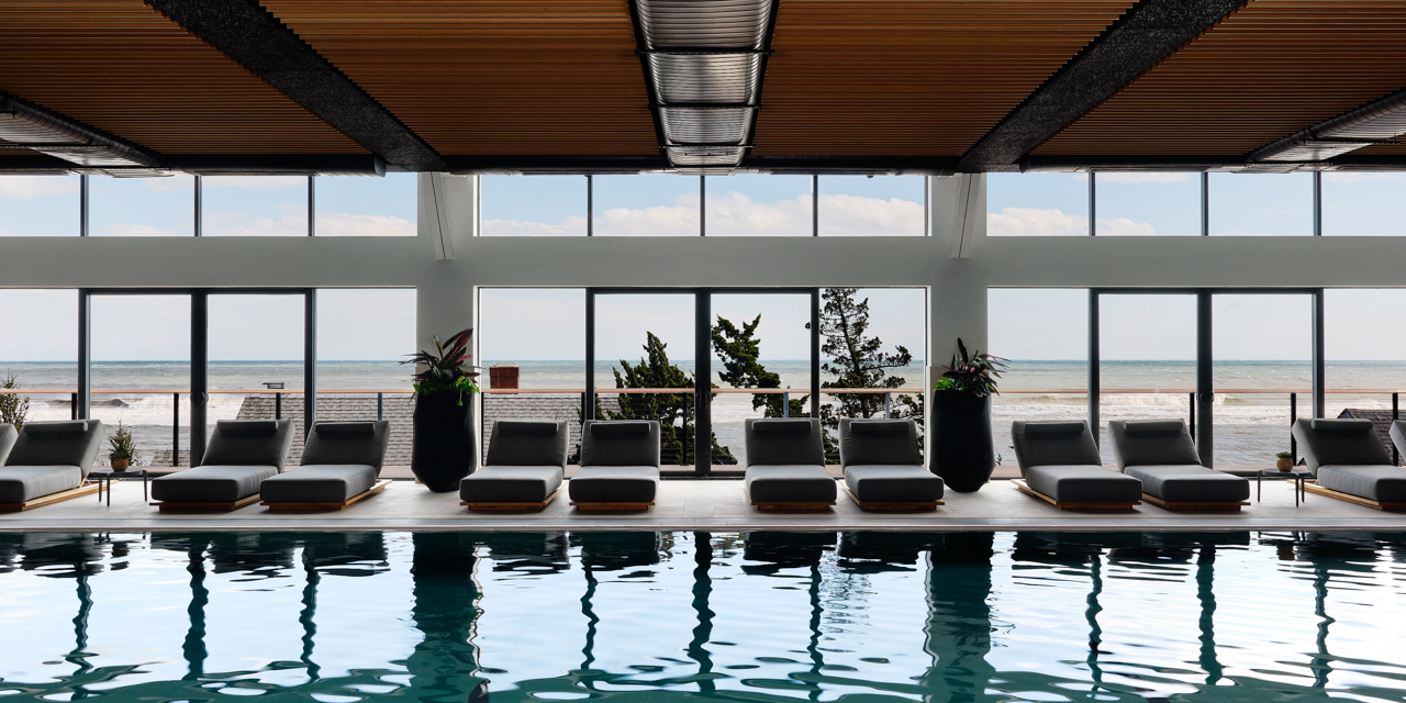 Seawater Spa pool with lounge chairs and ocean view.